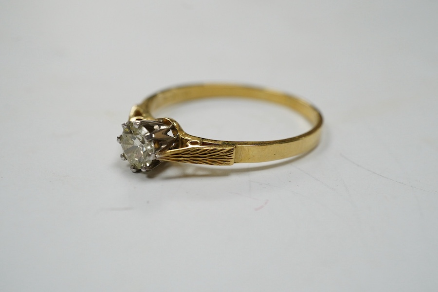 A modern 18ct gold and solitaire diamond set ring, size V, gross weight 3.1 grams. Condition - fair